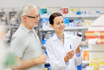 pharmacist and senior men customer with drug and prescription